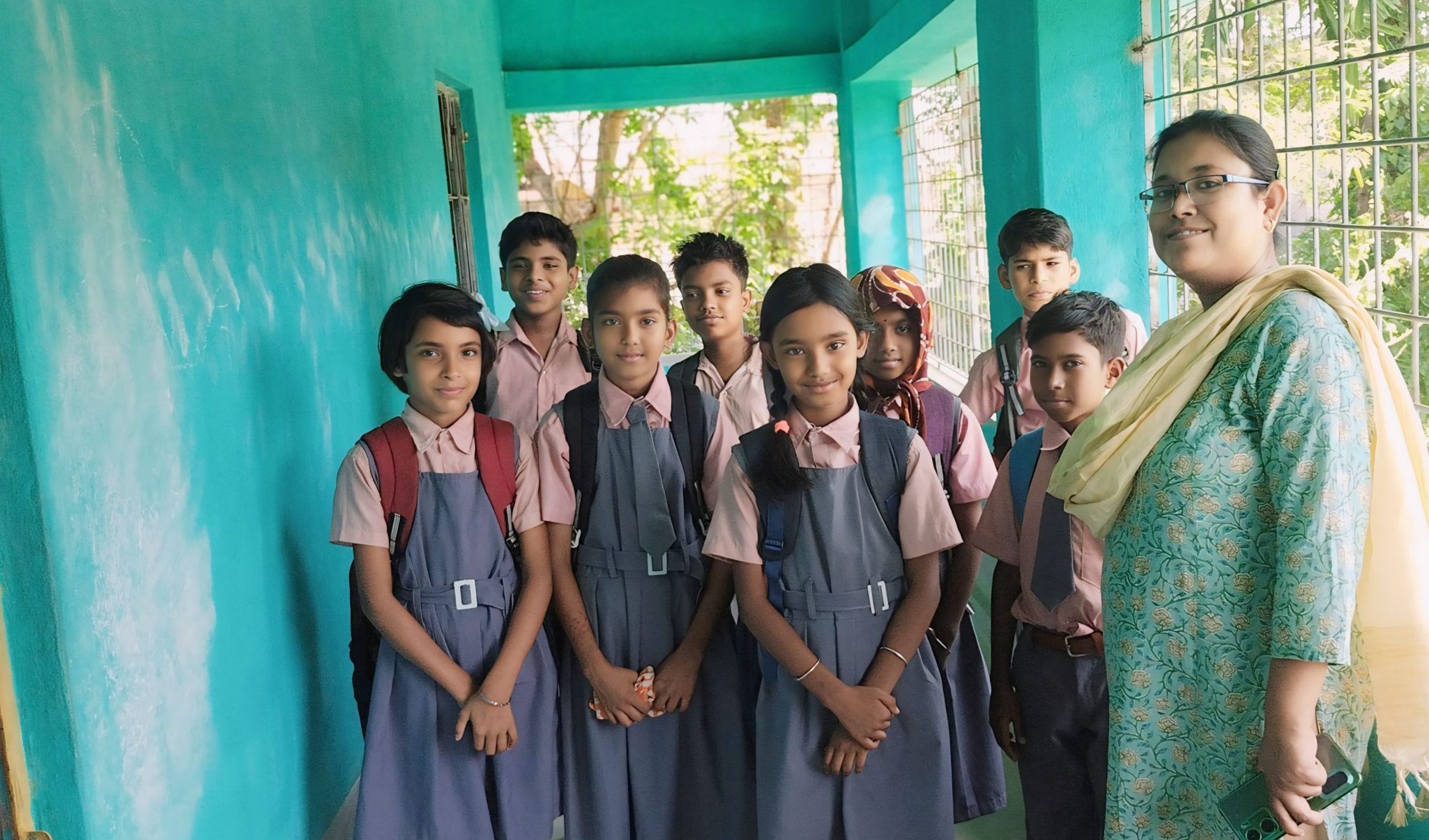 Teacher standing with her pupils