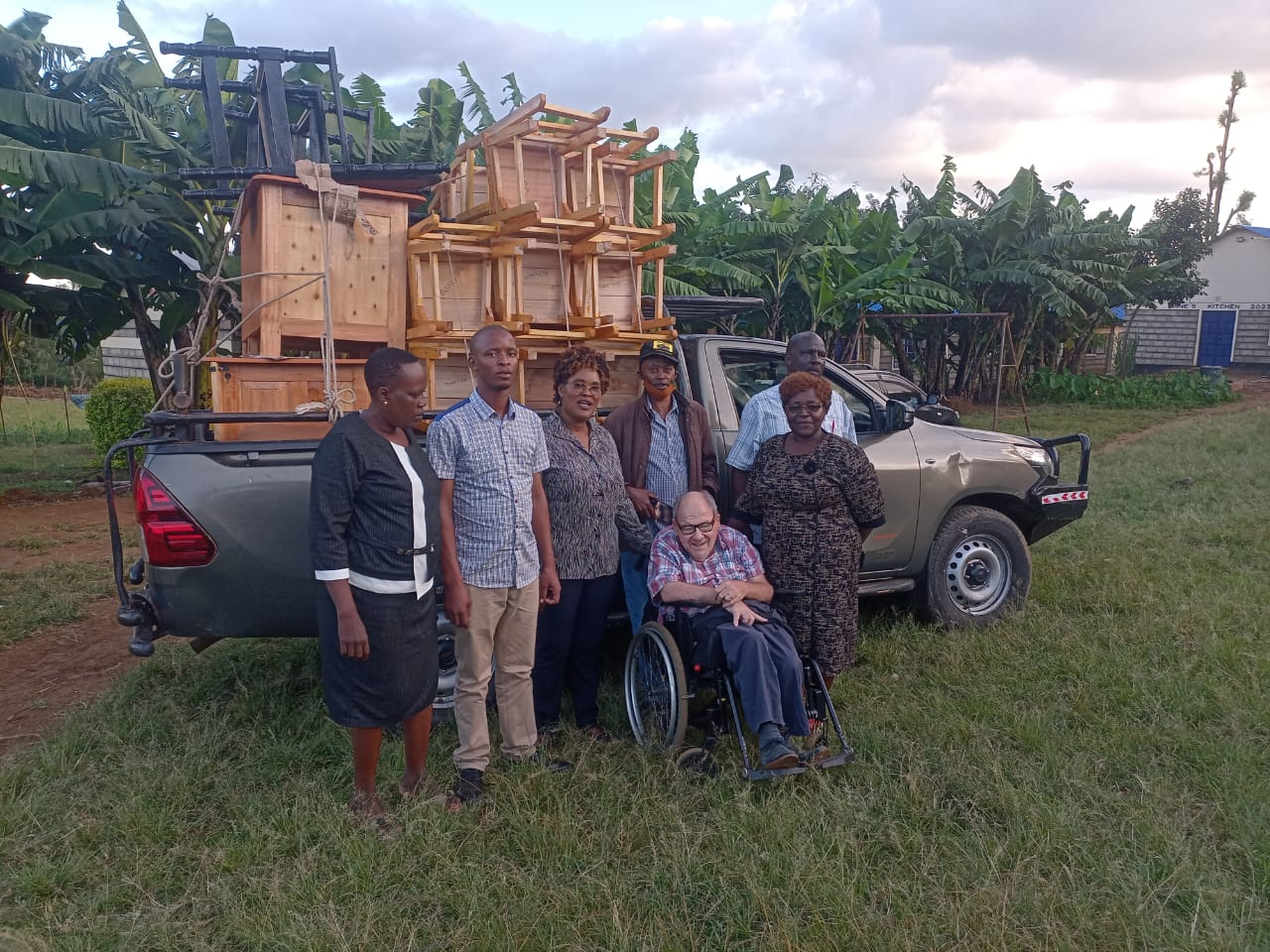 Group of people with a loaded pickup truck